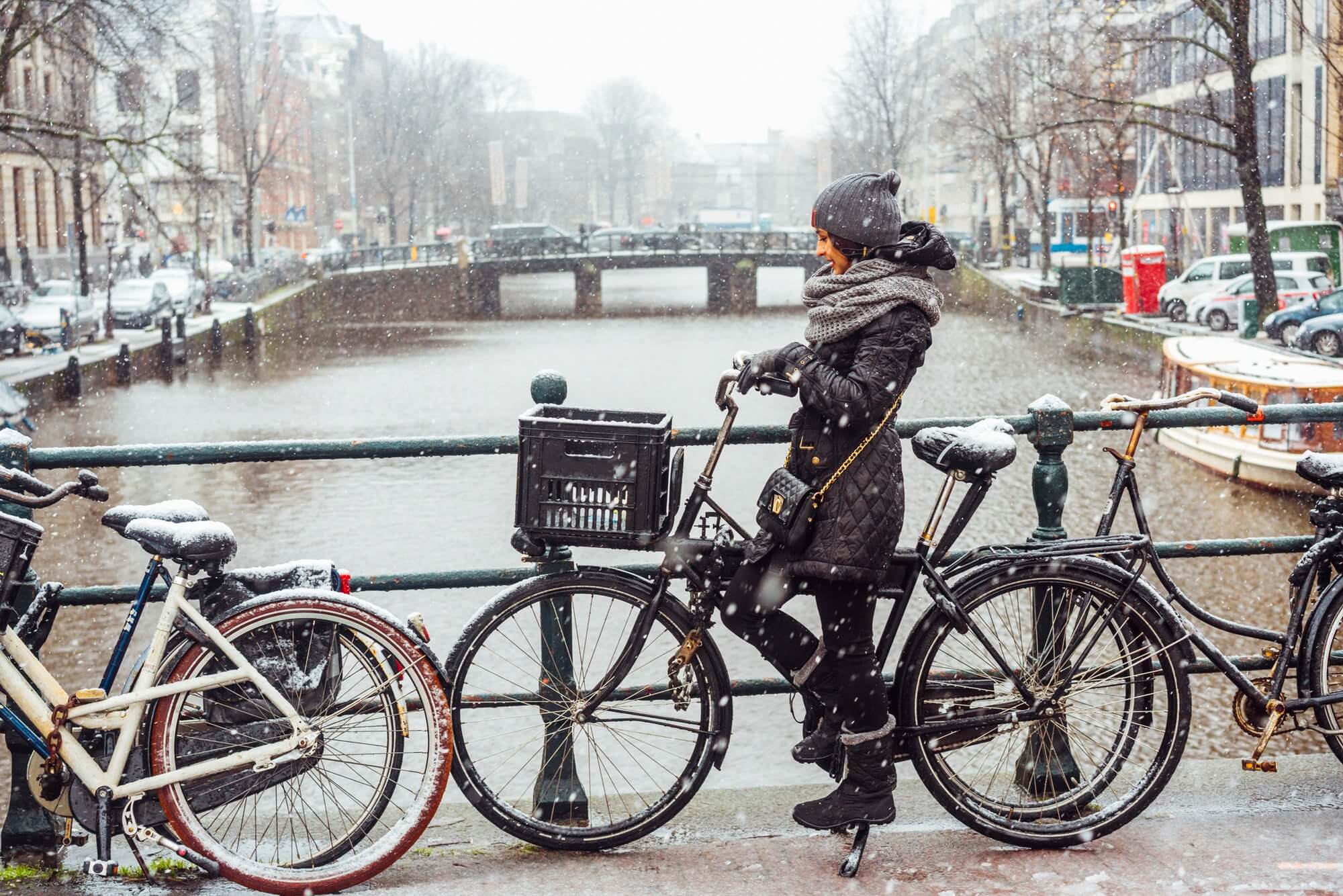 Girl on a bicycle on the bridge in Amsterdam